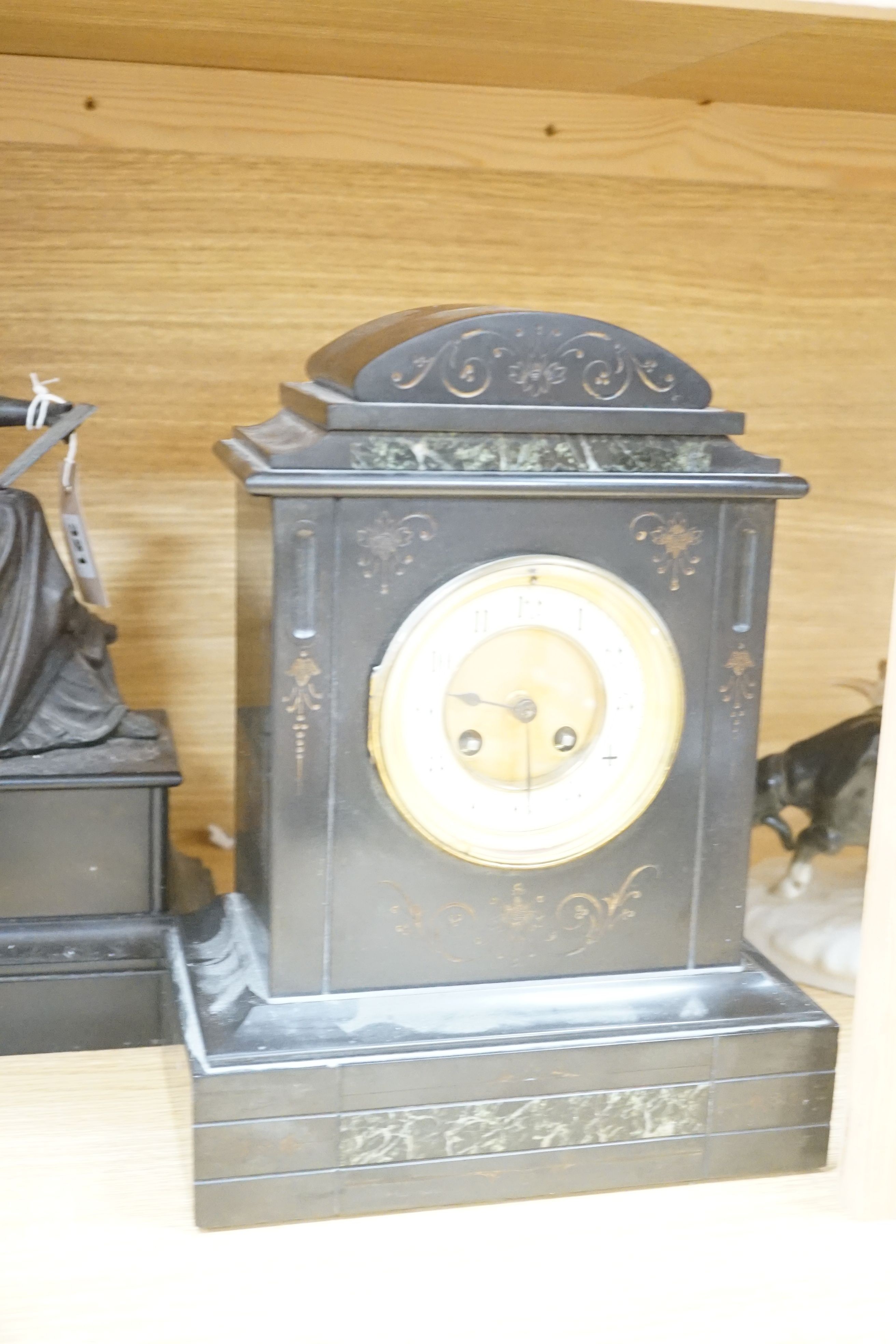 An inlaid mahogany mantel clock, slate mantel clock and a figural spelter mantel clock (3)